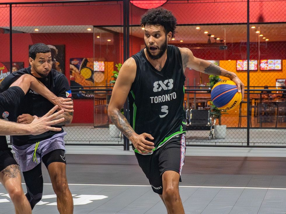 A player driving to the basket on the 3x3 court at Imus