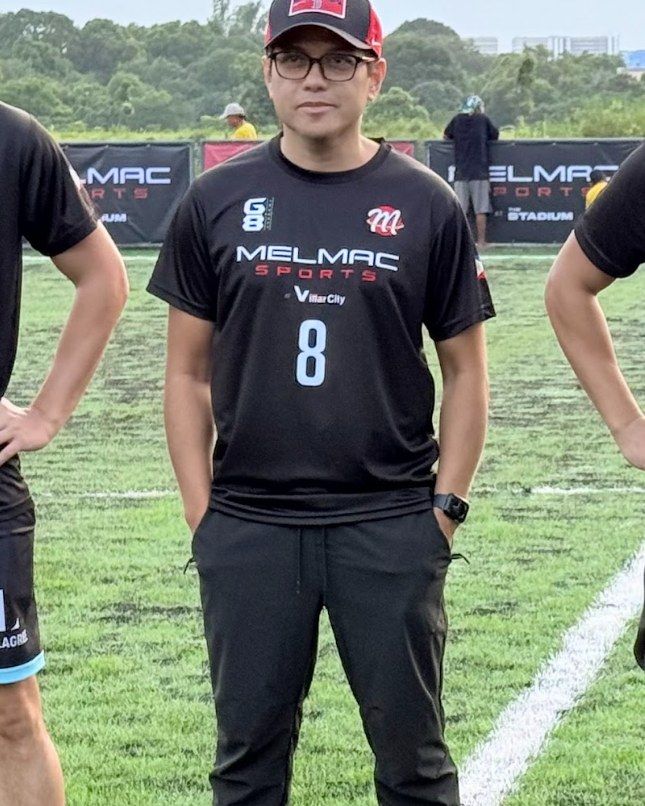 Mel Macasaquit in a Melmac Sports shirt on the pitch at Villar City