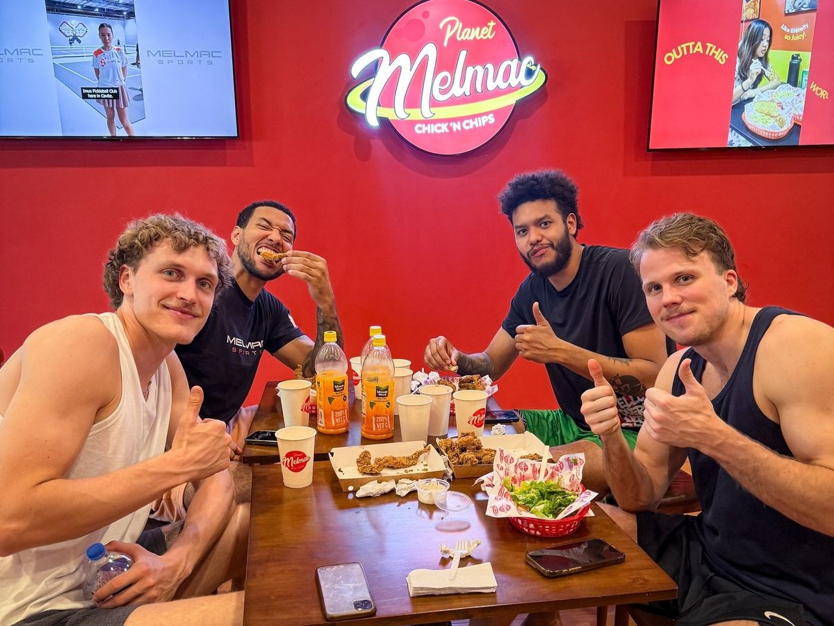 A group of players sharing chicken and chips at Planet Melmac Imus