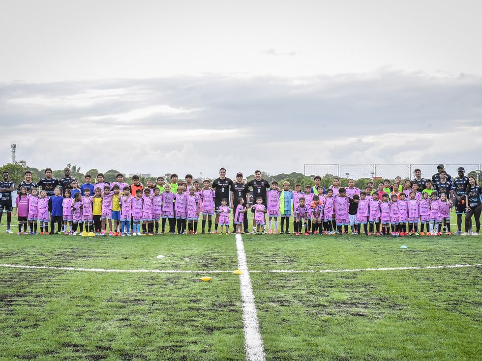 Players and coaches lined up across the pitch at the Villar City soft launch