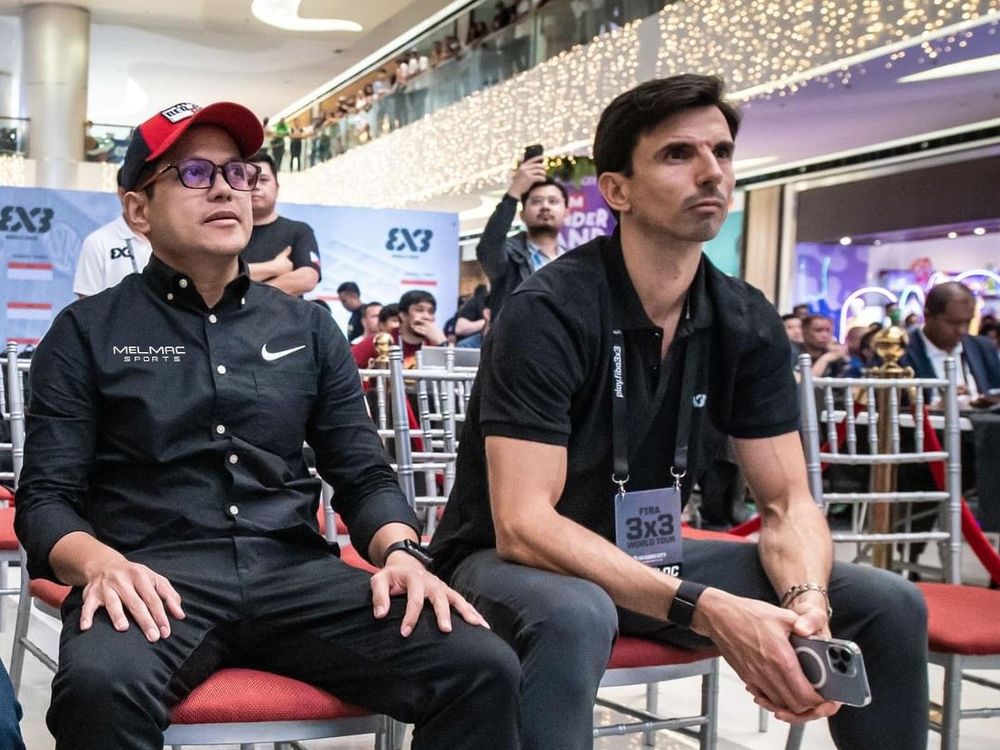 Mel Macasaquit seated courtside at a FIBA 3x3 World Tour event