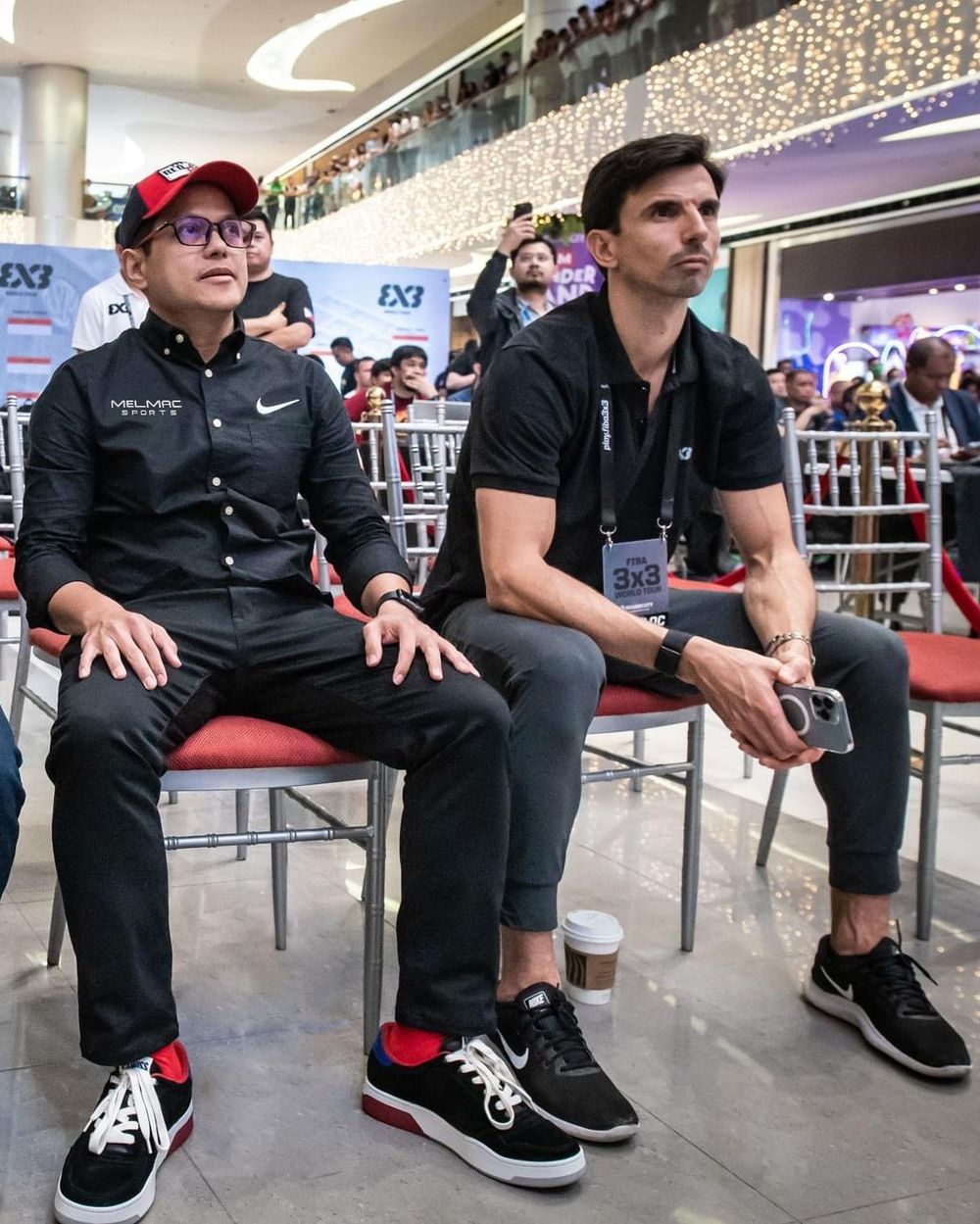 Mel Macasaquit seated courtside at a FIBA 3x3 World Tour event